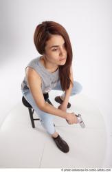 MOLLY SITTING POSE WITH GUN 2